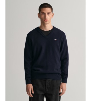 Trje med V-udskring i marinebl fin uld