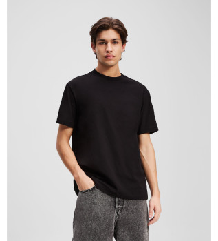 T-shirt med svart patch och logotyp