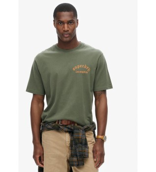 T-shirt allentata con grafica verde sul retro del tatuaggio