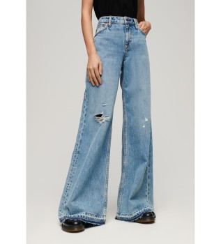 Rozkloszowane dżinsy z szeroką nogawką i surowymi obszyciami w kolorze niebieskim