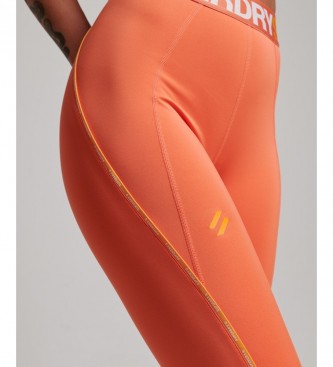 Superdry Leggings attillati elasticizzati con strascico arancione