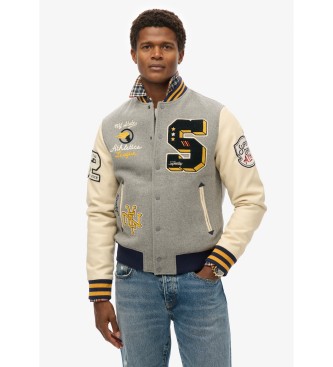 Superdry Bursztynowa kurtka z szarą naszywką uniwersytecką