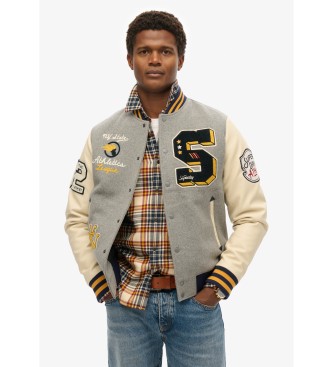 Superdry Bursztynowa kurtka z szarą naszywką uniwersytecką