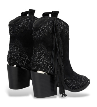 Alma en pena Leather ankle boots with black fringes on the sides