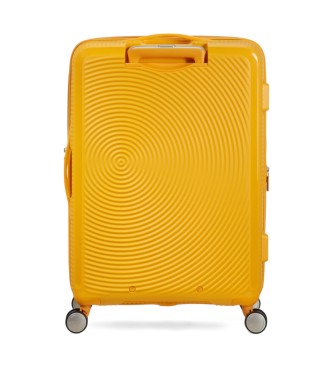 American Tourister Soundbox Spinner srednji trdi kovček rumene barve