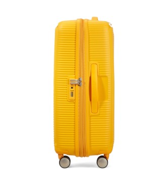 American Tourister Soundbox Spinner srednji trdi kovček rumene barve