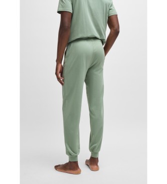 BOSS Tracksuit bottoms in stretch cotton with cuffs and green embroidered logo