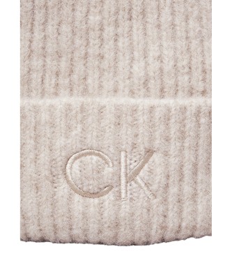 Calvin Klein Bonnet beige tricot avec pompon