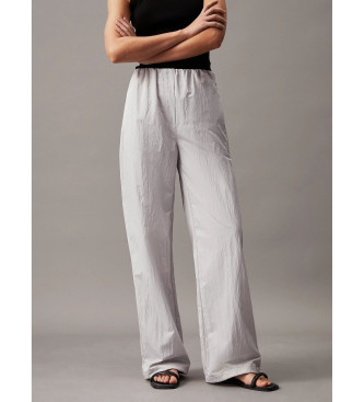 Calvin Klein Jeans Hlače Parachute Baggy Trousers sive barve