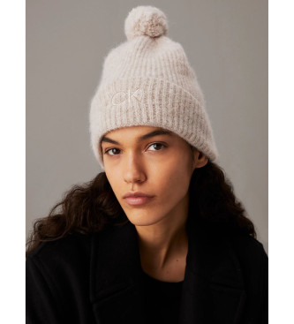 Calvin Klein Bonnet beige tricot avec pompon