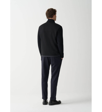 Colmar Jakke med sorte, strikkede rmer