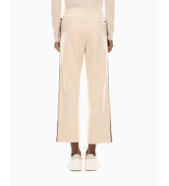 EA7 Sportowe spodnie 4Ever w kolorze beżowym