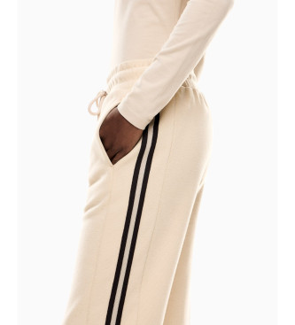 EA7 Sportowe spodnie 4Ever w kolorze beżowym