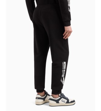 EA7 Tracksuit bottoms Graphic Series in black cotton