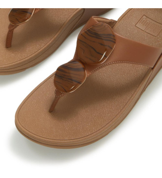 Fitflop Sandali Lulu con cinturino tra le dita e motivo marmorizzato, colore marrone.