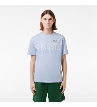 Lacoste T-shirt med kontrastfrgat tryck och bltt mrke