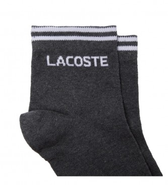 Lot de 2 paires de chaussettes basses noire et blanche unies avec nom  imprimé LACOSTE VÊTEMENT - CCV Mode