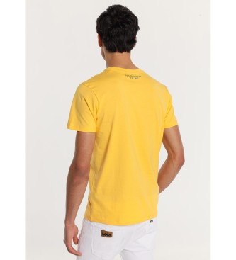Lois Jeans Żółta koszulka z krótkim rękawem z akwarelowym nadrukiem
