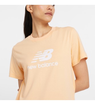 New Balance Sport Essentials majica z logotipom Jersey oranžna