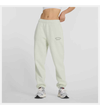 New Balance Pantaloni jogger in pile con grafica verde