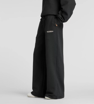 New Balance Pantalon large en polaire rinvent noir