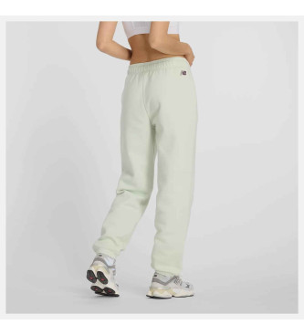 New Balance Pantaloni jogger in pile con grafica verde