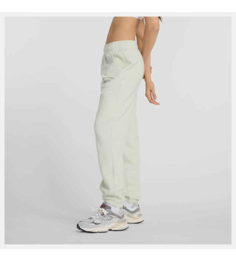 New Balance Pantaloni jogger in pile con grafica verde