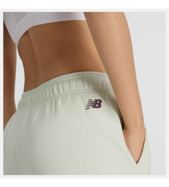 New Balance Pantaloni jogger in pile con grafica verde