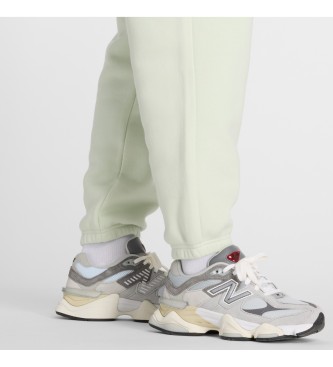 New Balance Pantaloni jogger in pile con grafica verde