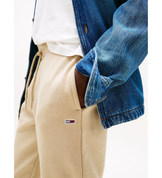 Tommy Jeans Jogger hlače z elastičnim spodnjim delom v bež barvi