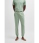 BOSS Tracksuit bottoms in stretch cotton with cuffs and green embroidered logo